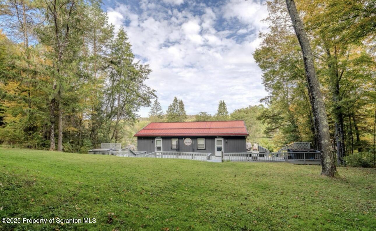 4562 Highway 374 Nicholson, PA 18446 - Photo 35 of 38 a view of a house with a yard