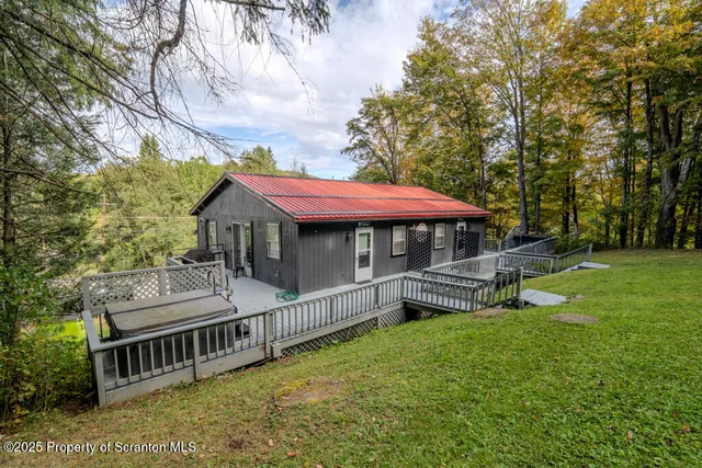 a view of roof deck with patio
