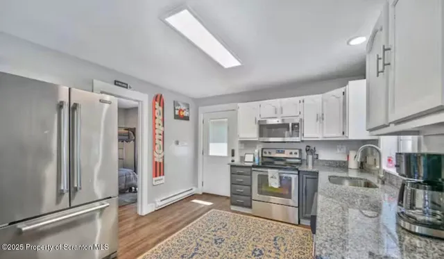 a kitchen with a sink stove and cabinets