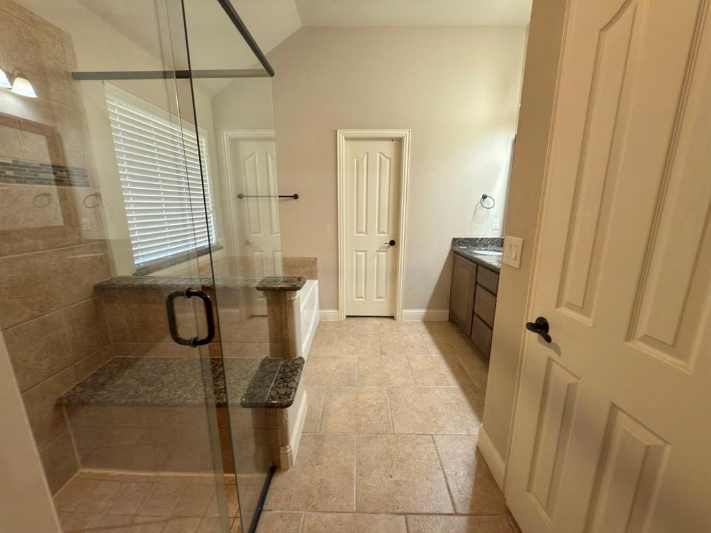 1017 Knoxbridge Road Forney, TX 75126 - Photo 14 of 16 a bathroom with a granite countertop shower and a sink