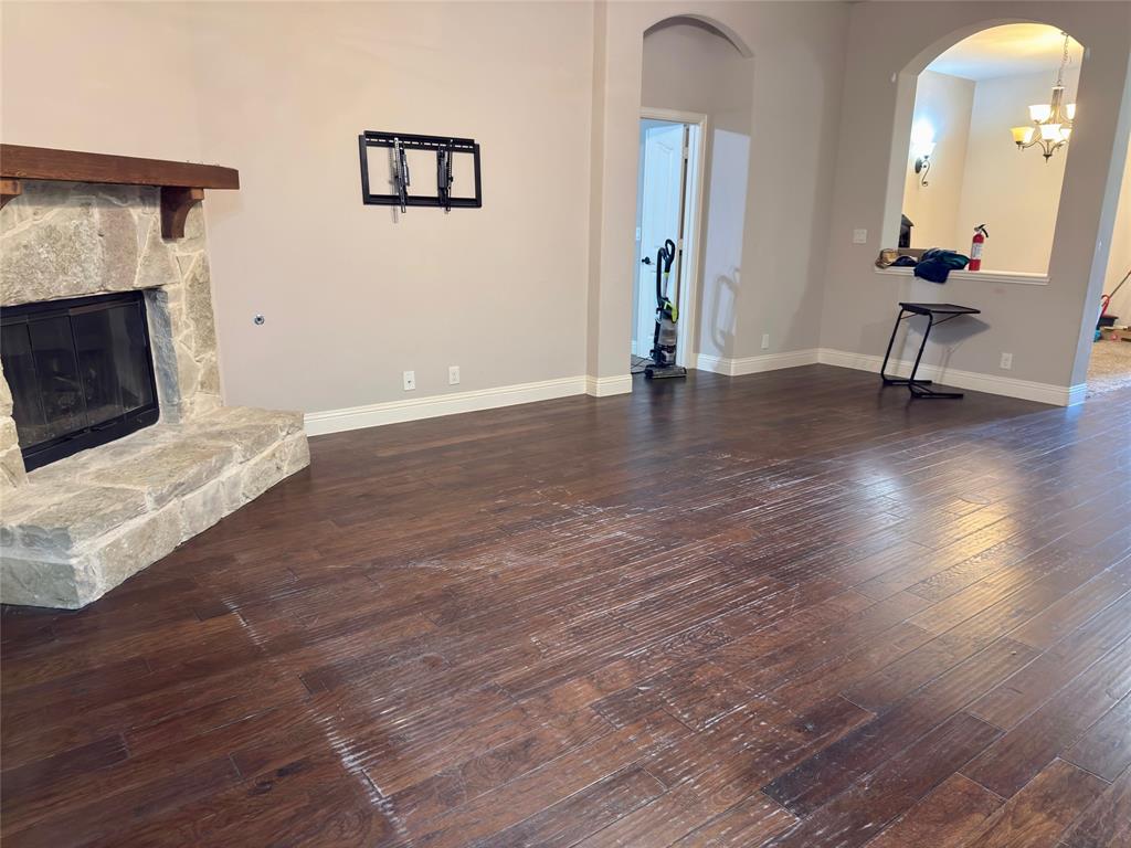 1017 Knoxbridge Road Forney, TX 75126 - Photo 7 of 16 a view of a livingroom with wooden floor and a fireplace