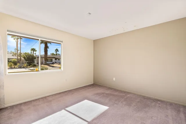 an empty room with window