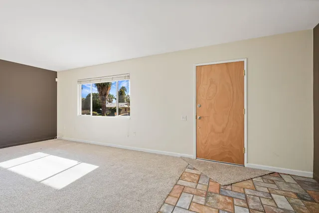 a view of an empty room and window