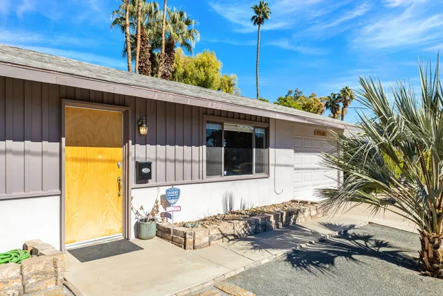 a front view of a house with a outdoor space
