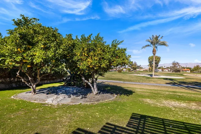 a view of a swimming pool with an outdoor space and seating area