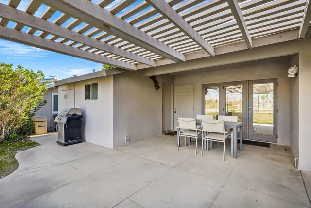 a dining room with furniture and a window