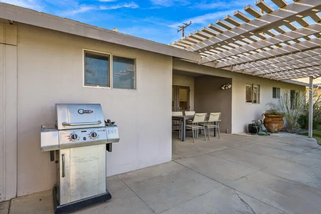 a view of a room that has a table and a chair