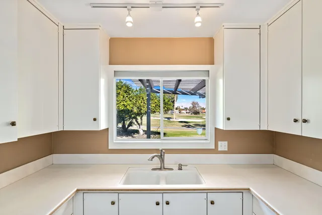 a kitchen with a sink and a window