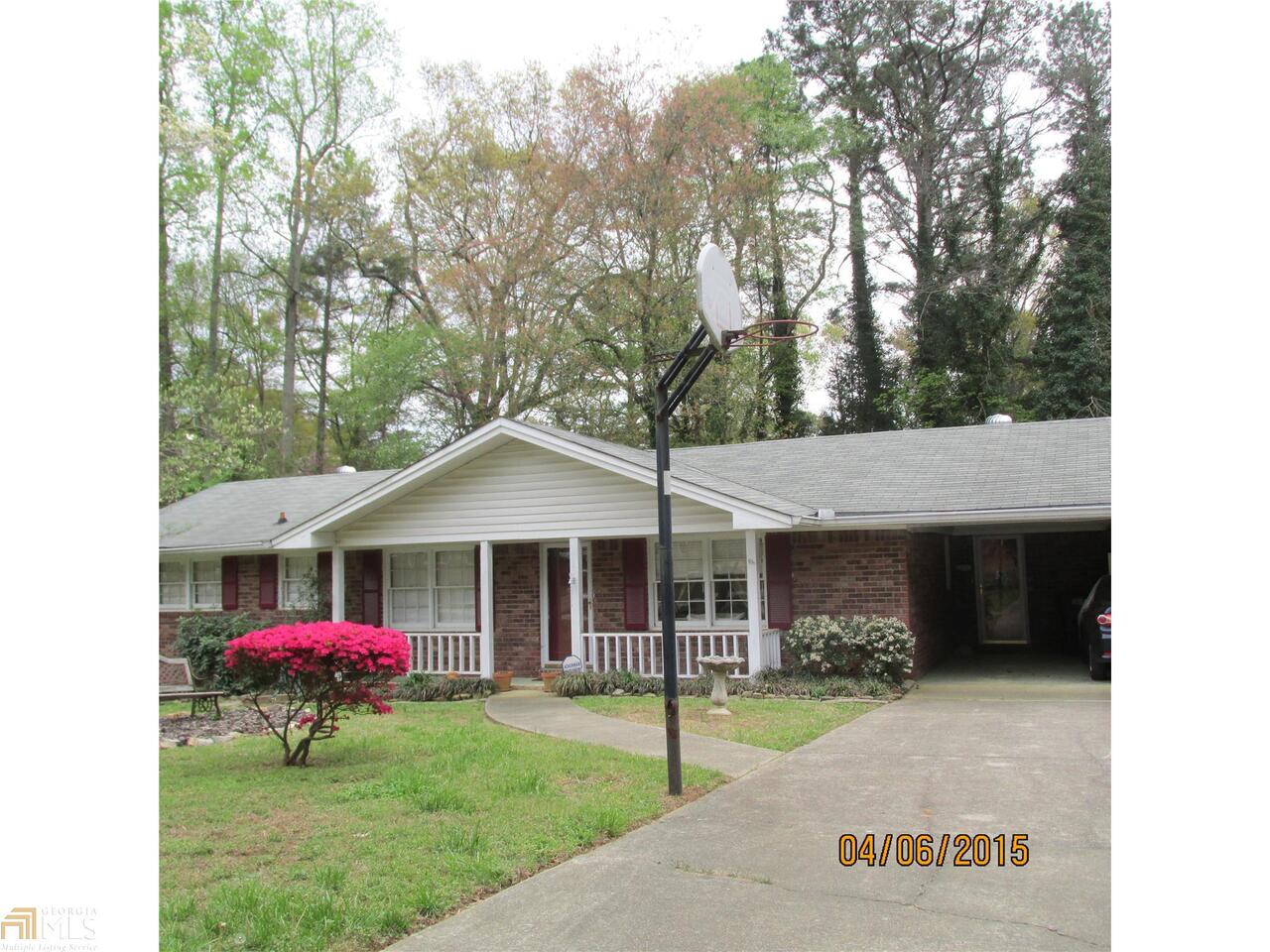 4121 Cedar Ridge Road, Unit 54 Powder Springs, GA 30127 - Photo 1 of 1 a front view of a house with garden