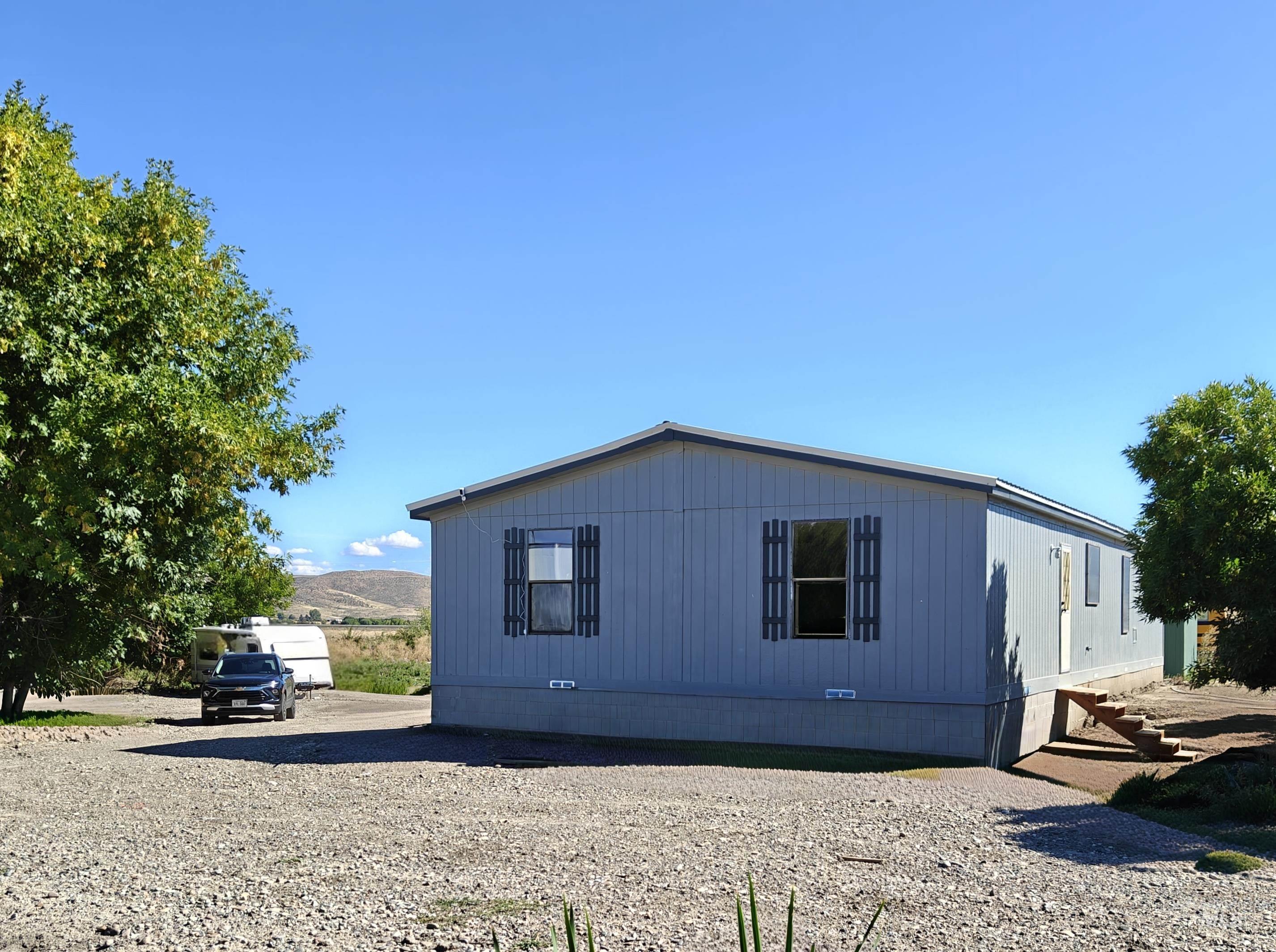 1348 Hoover Road Weiser, ID 83672 - Photo 1 of 1 View of side of property with crawl space and a mountain view