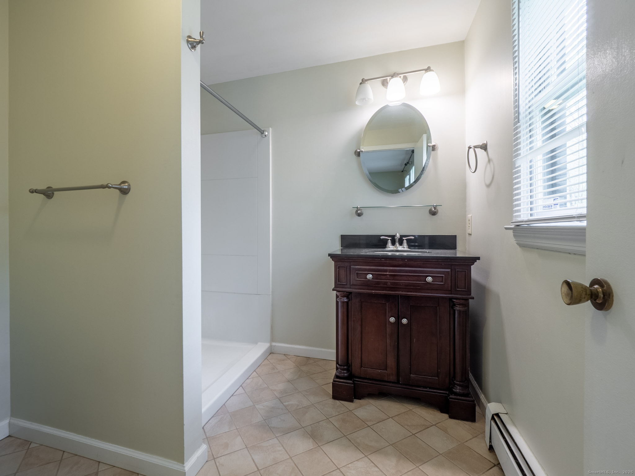 21 Simpaug Turnpike Redding, CT 06896 - Photo 15 of 22 a room with a mirror and vanity