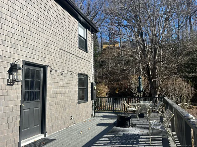 a view of balcony with couch and trees