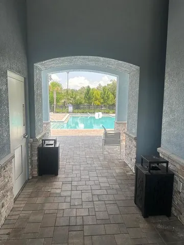 a view of a room with a large window