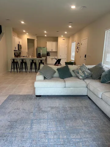 a living room with furniture and a table