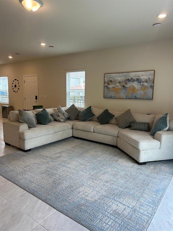 4669 Sparkling Shell Avenue Kissimmee, FL 34746 - Photo 5 of 21 a living room with furniture and a couch