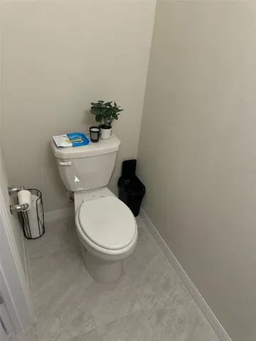 a bathroom with a toilet and a sink