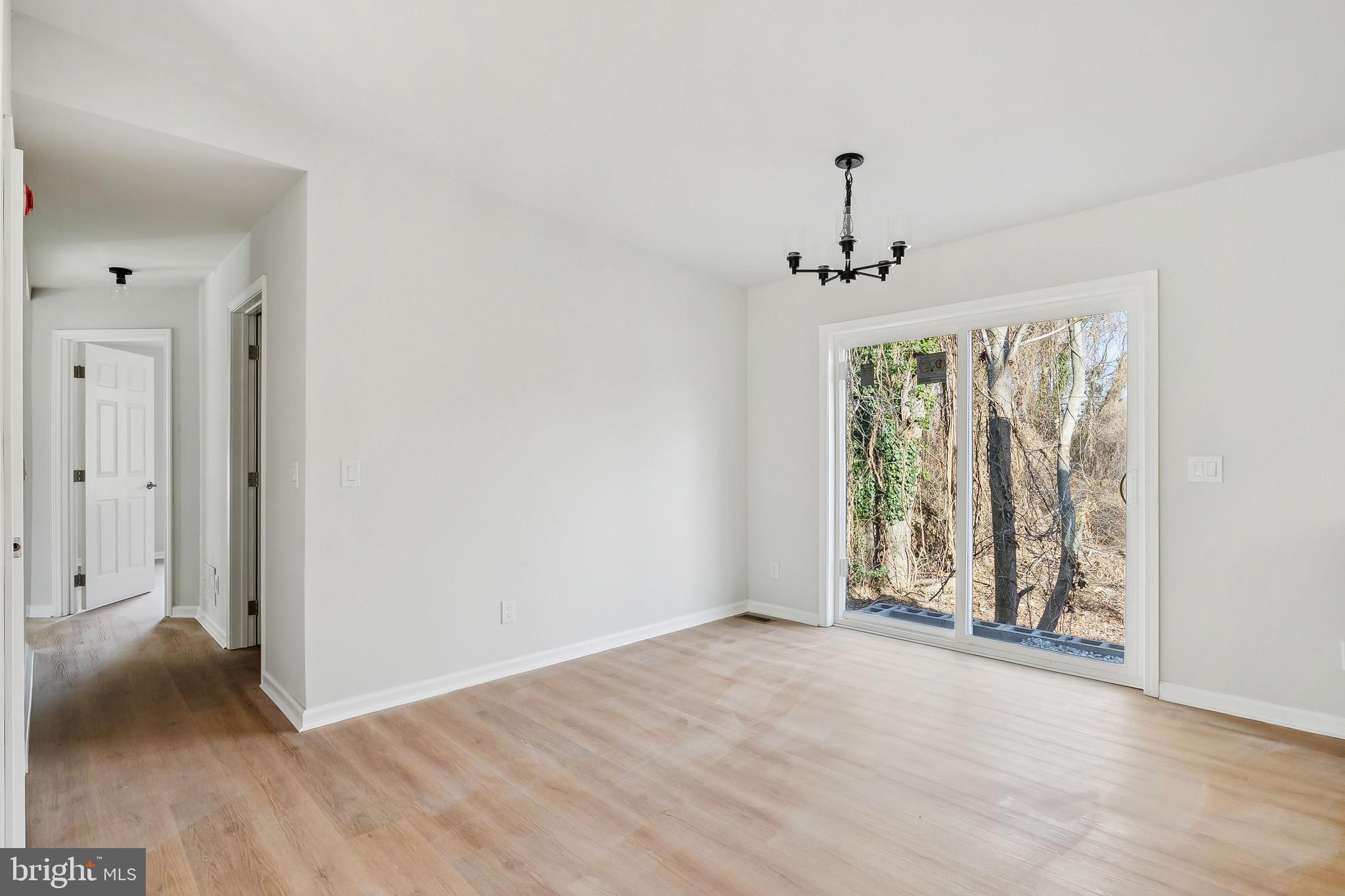 47 Highland Avenue Clementon, NJ 08021 - Photo 4 of 19 a view of an empty room with a window