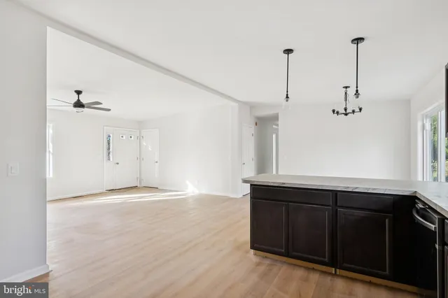 a view of a kitchen with a sink and cabinets