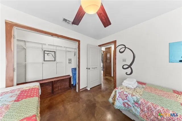 a bedroom with bed and a window