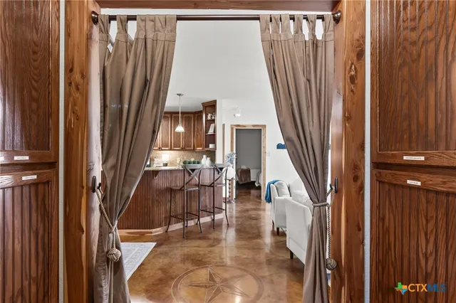 a view of a living room with a fireplace