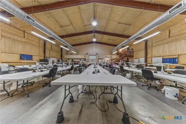 a room with lots of table and chairs