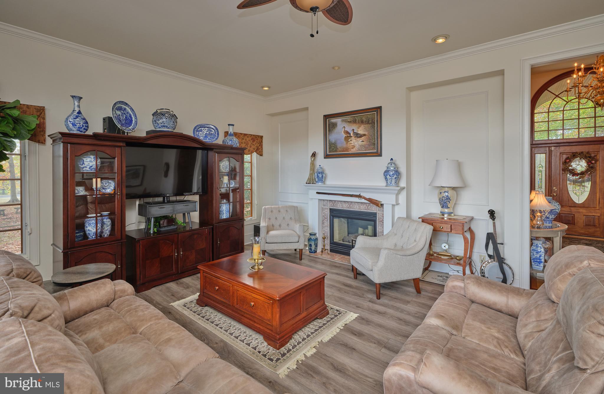 137 Wells Road Doylestown, PA 18901 - Photo 19 of 54 a living room with furniture a fireplace and a window