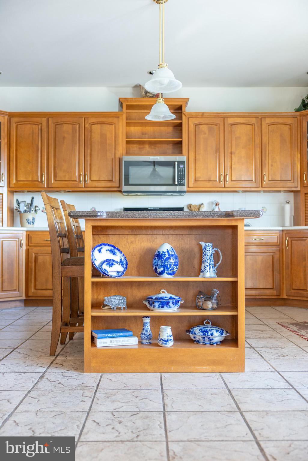137 Wells Road Doylestown, PA 18901 - Photo 21 of 102 a kitchen with stainless steel appliances granite countertop a stove a sink and a microwave