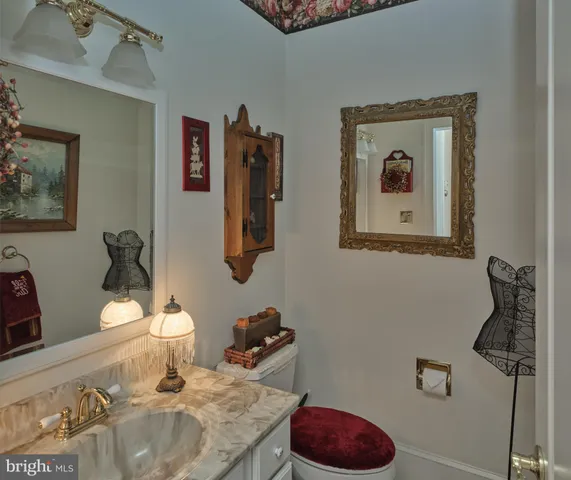 a bed room with a bed a couch and dresser