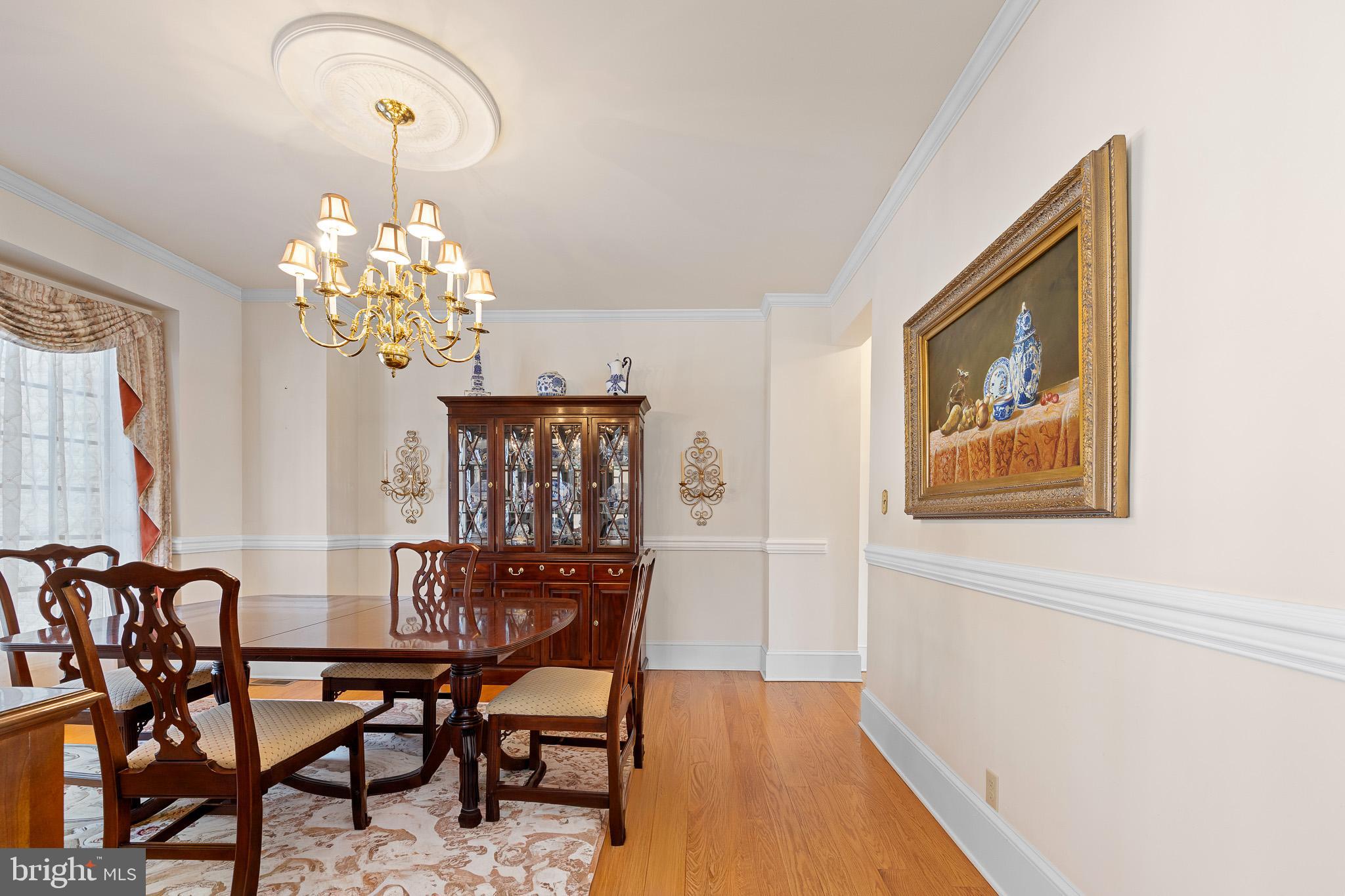 137 Wells Road Doylestown, PA 18901 - Photo 24 of 102 a view of a dining room with furniture and chandelier