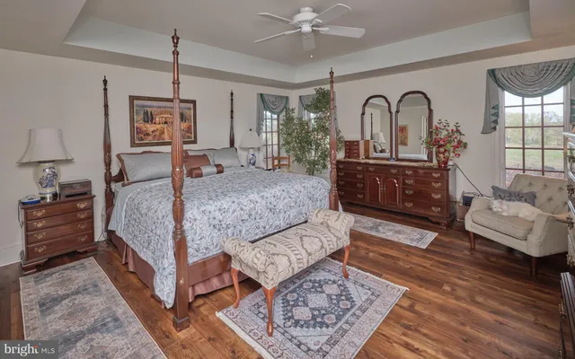 a bedroom with furniture and a window