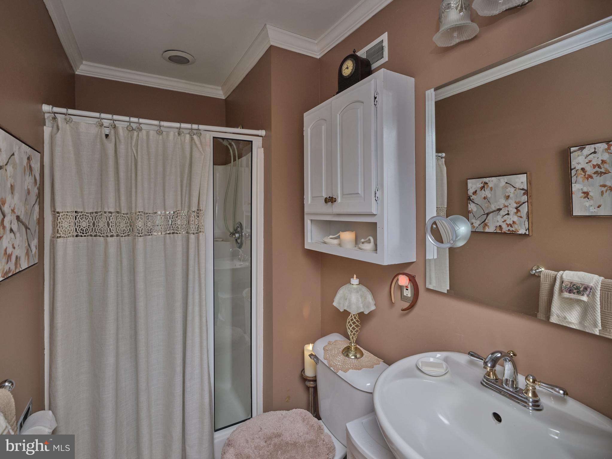 137 Wells Road Doylestown, PA 18901 - Photo 30 of 54 a bathroom with a toilet sink and shower