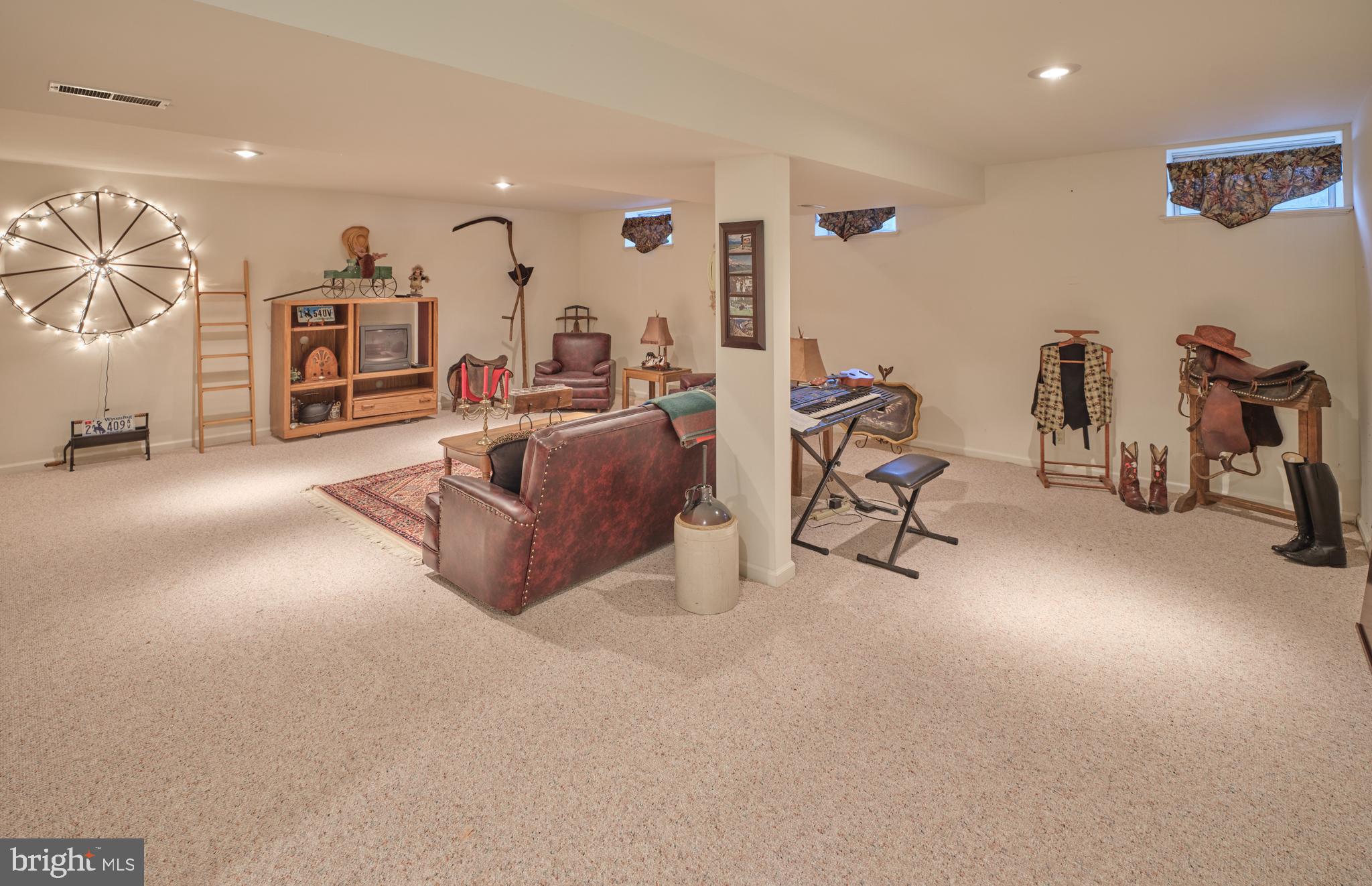 137 Wells Road Doylestown, PA 18901 - Photo 34 of 54 a living room with furniture and a flat screen tv