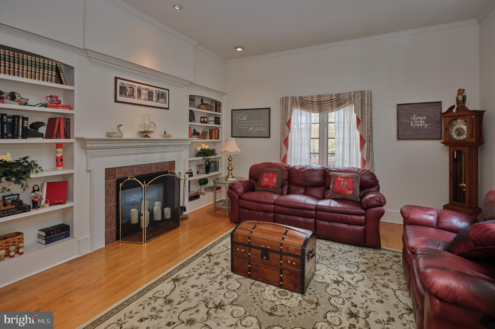 137 Wells Road Doylestown, PA 18901 - Photo 9 of 54 a living room with furniture and a fireplace