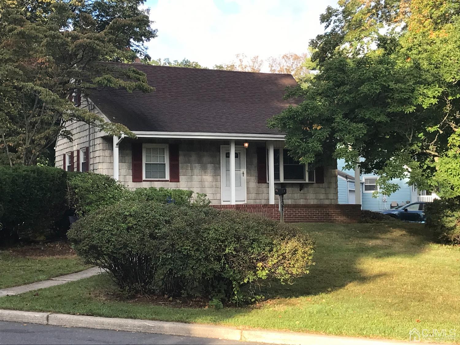 137 Milltown Road East Brunswick, NJ 08816 - Photo 2 of 22 a front view of a house with a yard