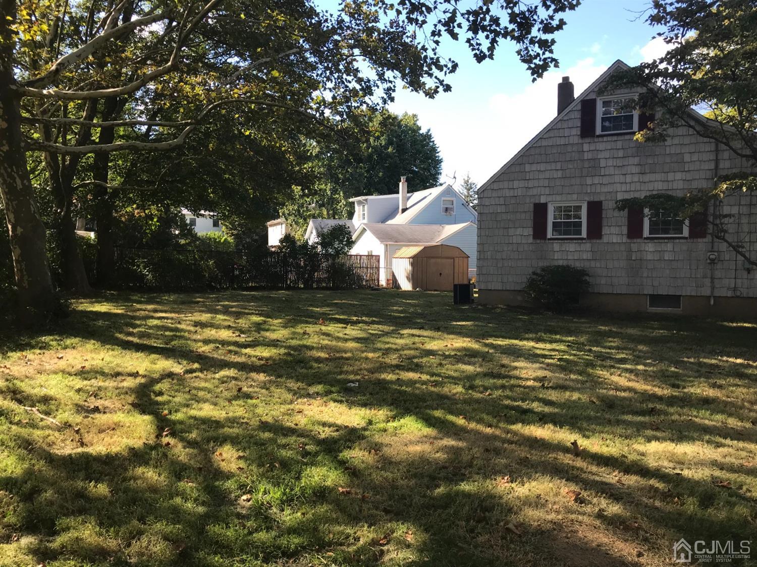 137 Milltown Road East Brunswick, NJ 08816 - Photo 20 of 22 a view of a house with a yard