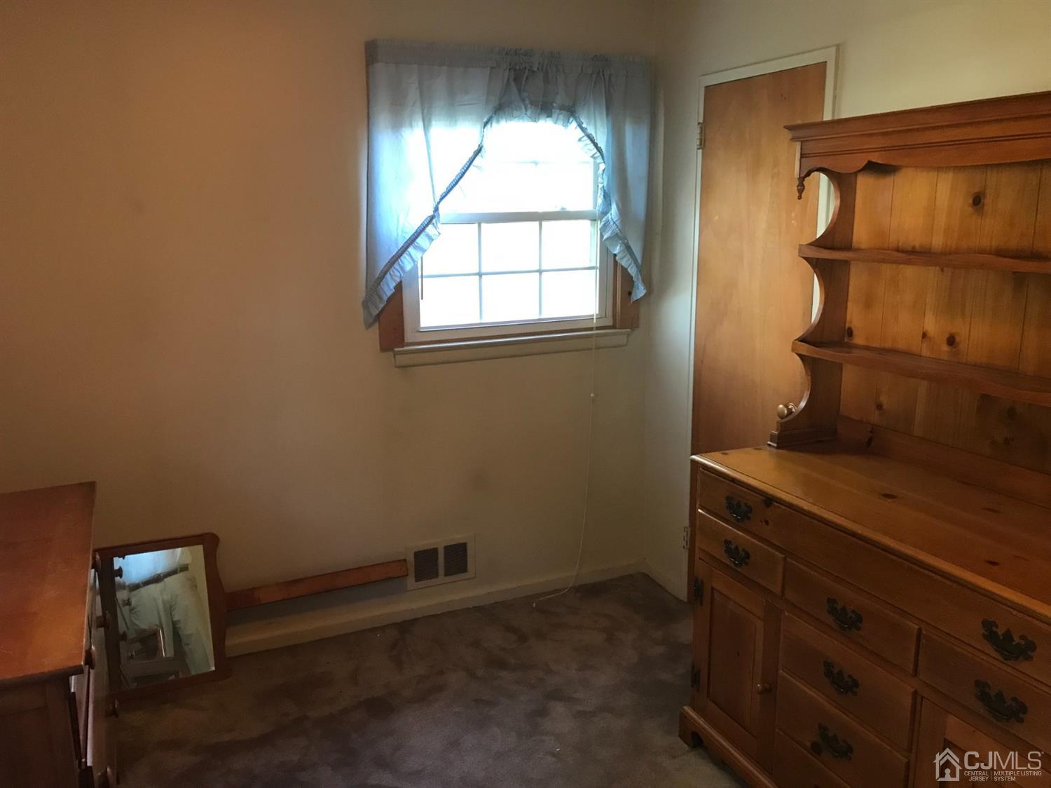 137 Milltown Road East Brunswick, NJ 08816 - Photo 10 of 22 a room with a window