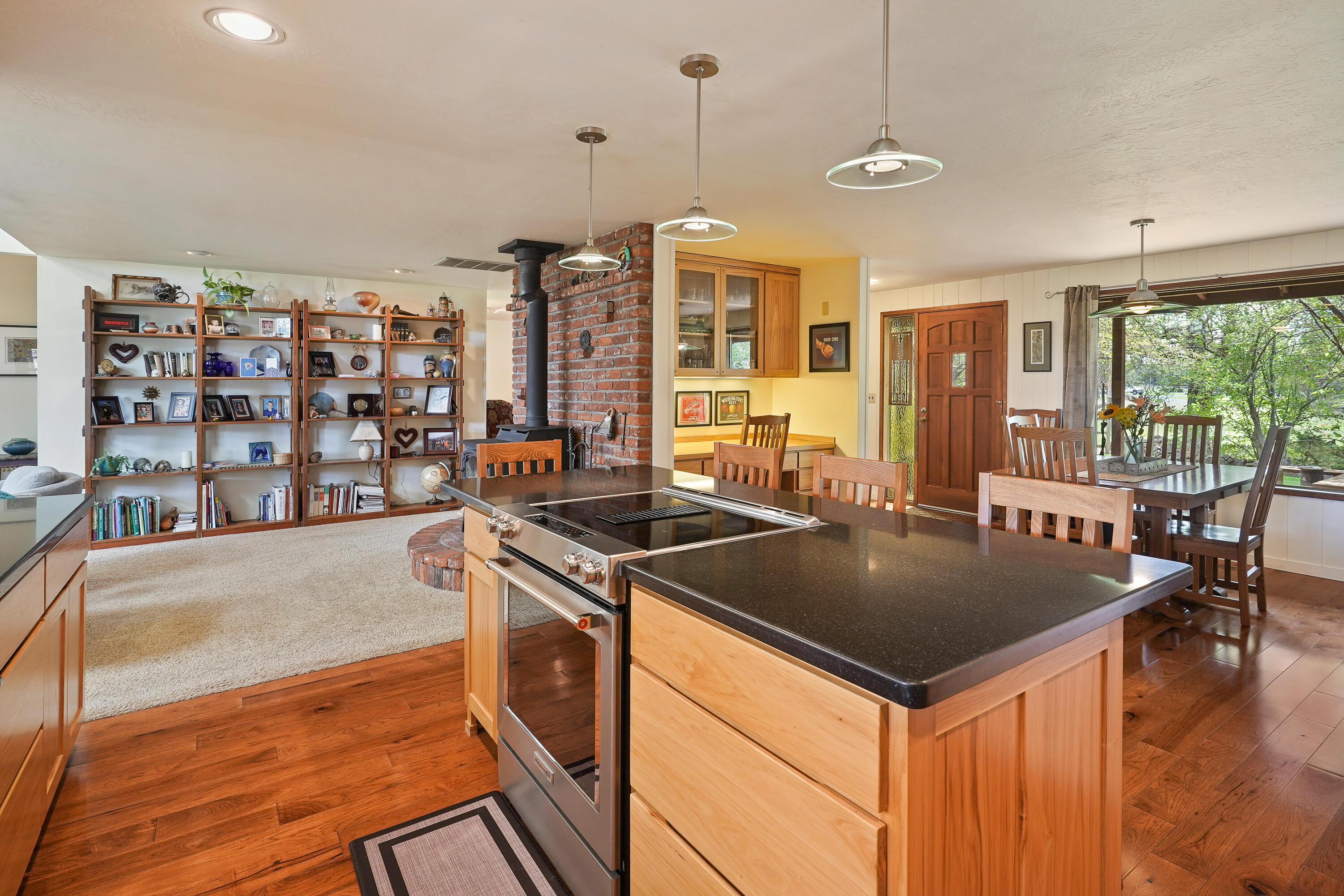 62636 Erickson Road Bend, OR 97701 - Photo 13 of 47 a kitchen with stainless steel appliances granite countertop a stove and a sink