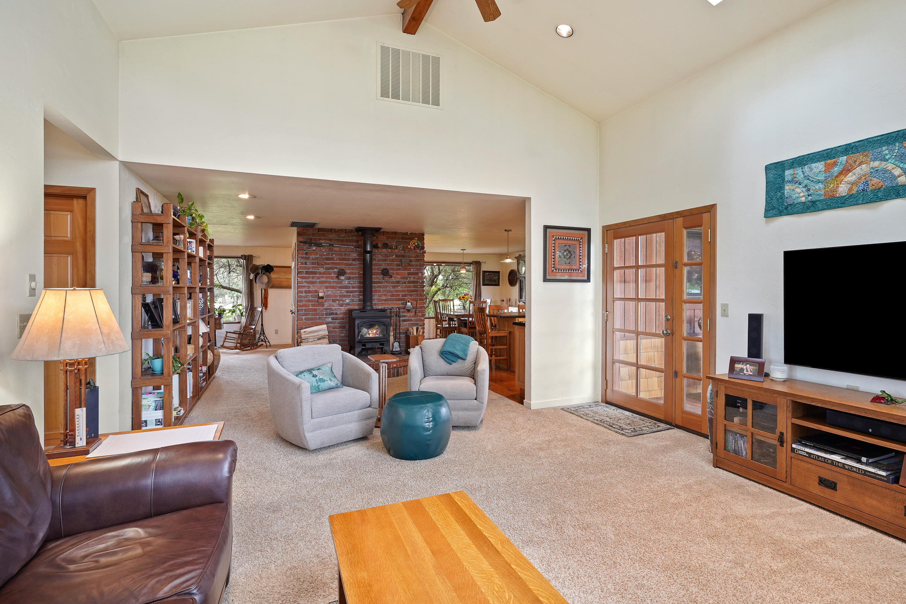 62636 Erickson Road Bend, OR 97701 - Photo 15 of 47 a living room with furniture and a flat screen tv