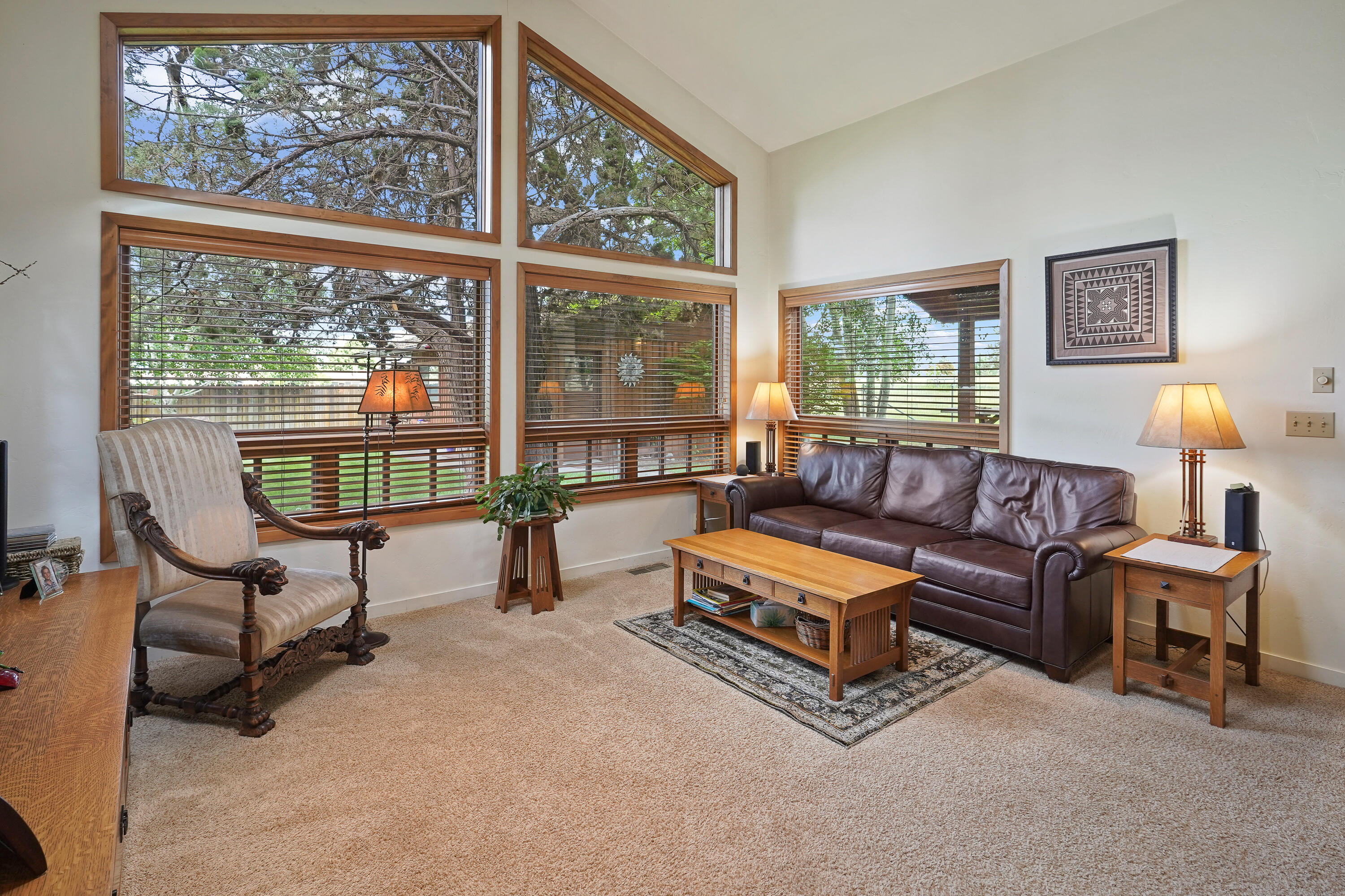62636 Erickson Road Bend, OR 97701 - Photo 17 of 47 a living room with furniture and a floor to ceiling window