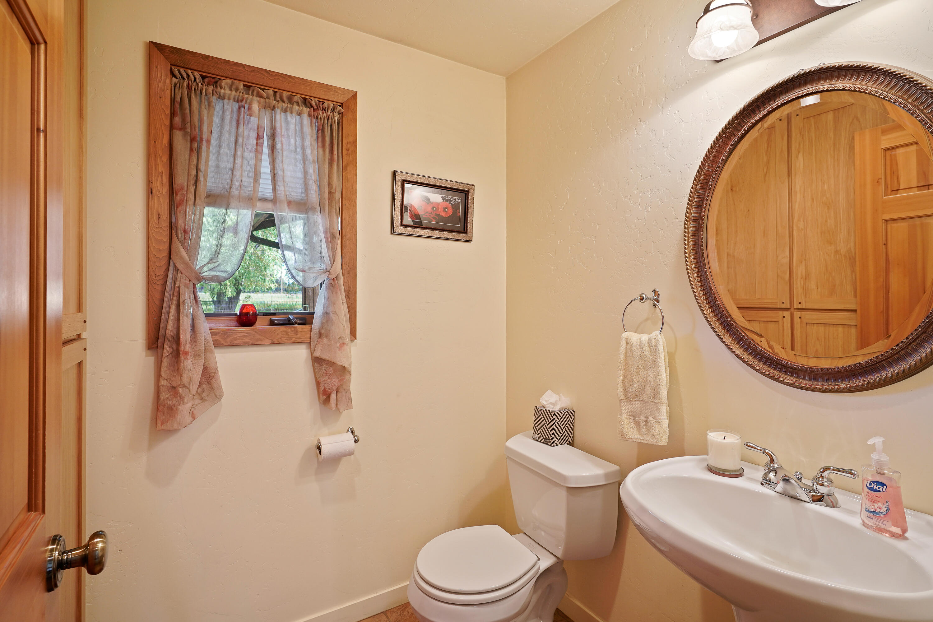 62636 Erickson Road Bend, OR 97701 - Photo 19 of 47 a bathroom with a sink a toilet and a mirror