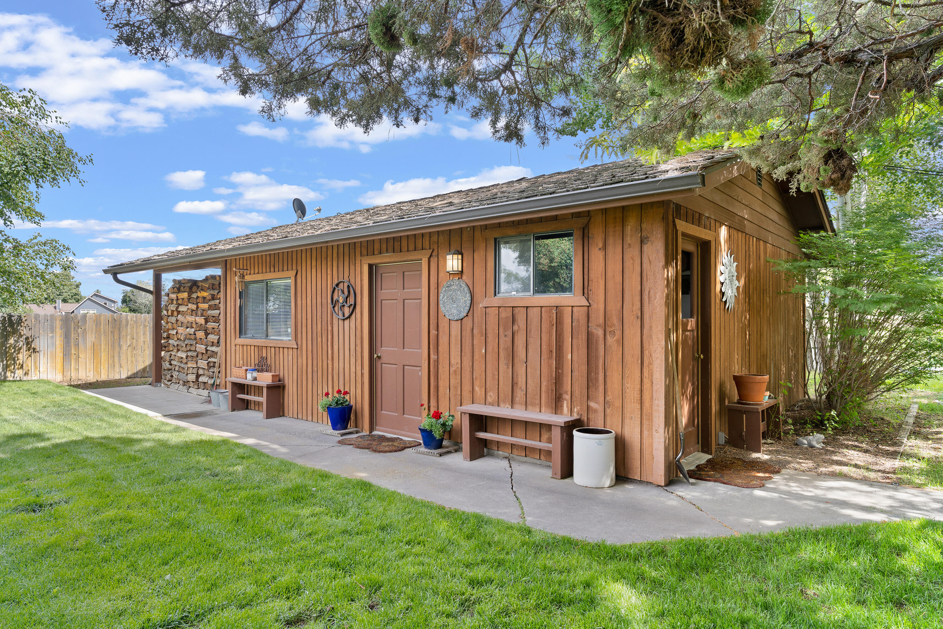 62636 Erickson Road Bend, OR 97701 - Photo 29 of 47 a view of a house with backyard and porch