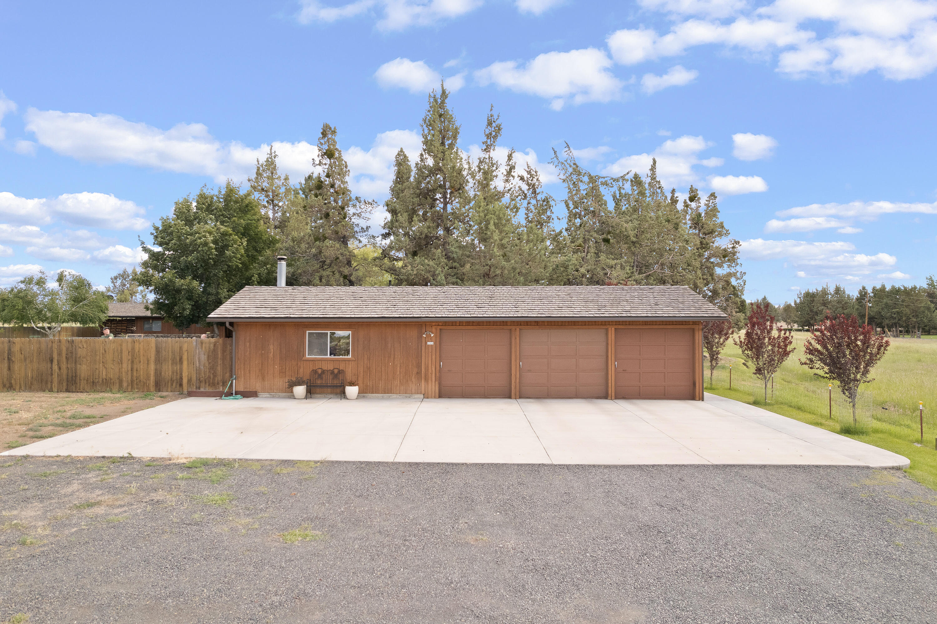 62636 Erickson Road Bend, OR 97701 - Photo 40 of 47 a front view of a house with a yard and garage