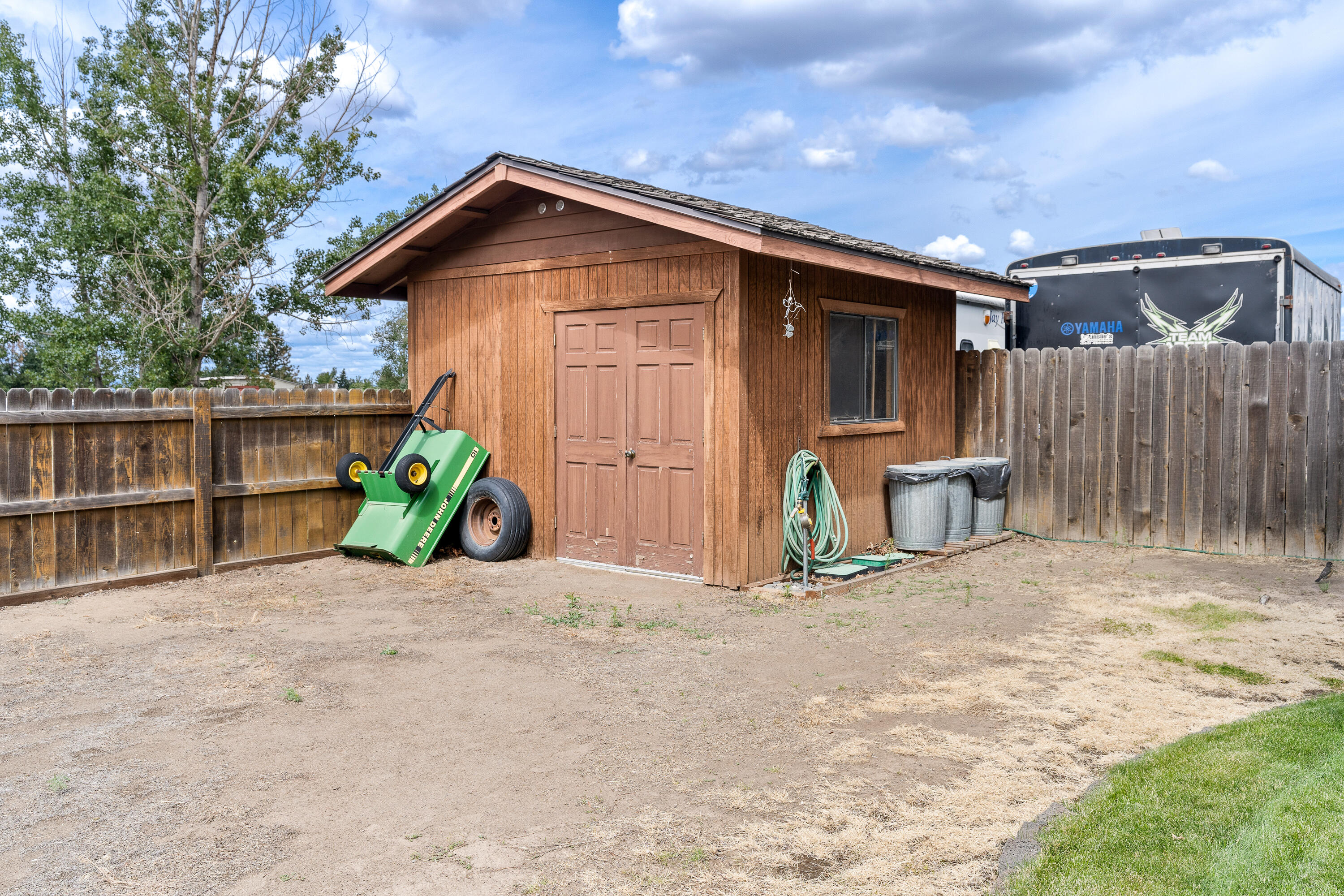 62636 Erickson Road Bend, OR 97701 - Photo 41 of 47 a view of a wooden house with a yard and large tree
