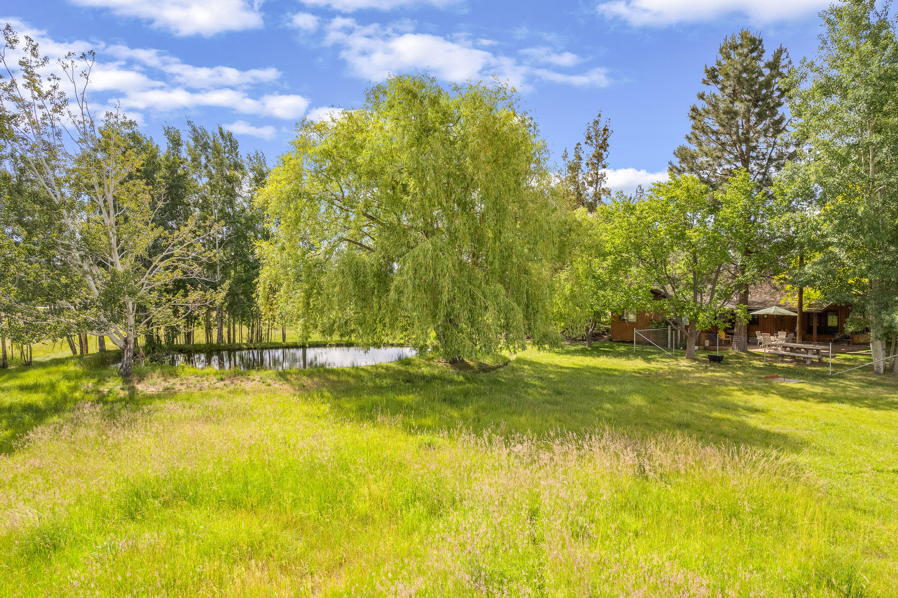 62636 Erickson Road Bend, OR 97701 - Photo 43 of 47 a view of a swimming pool with an outdoor space and seating area