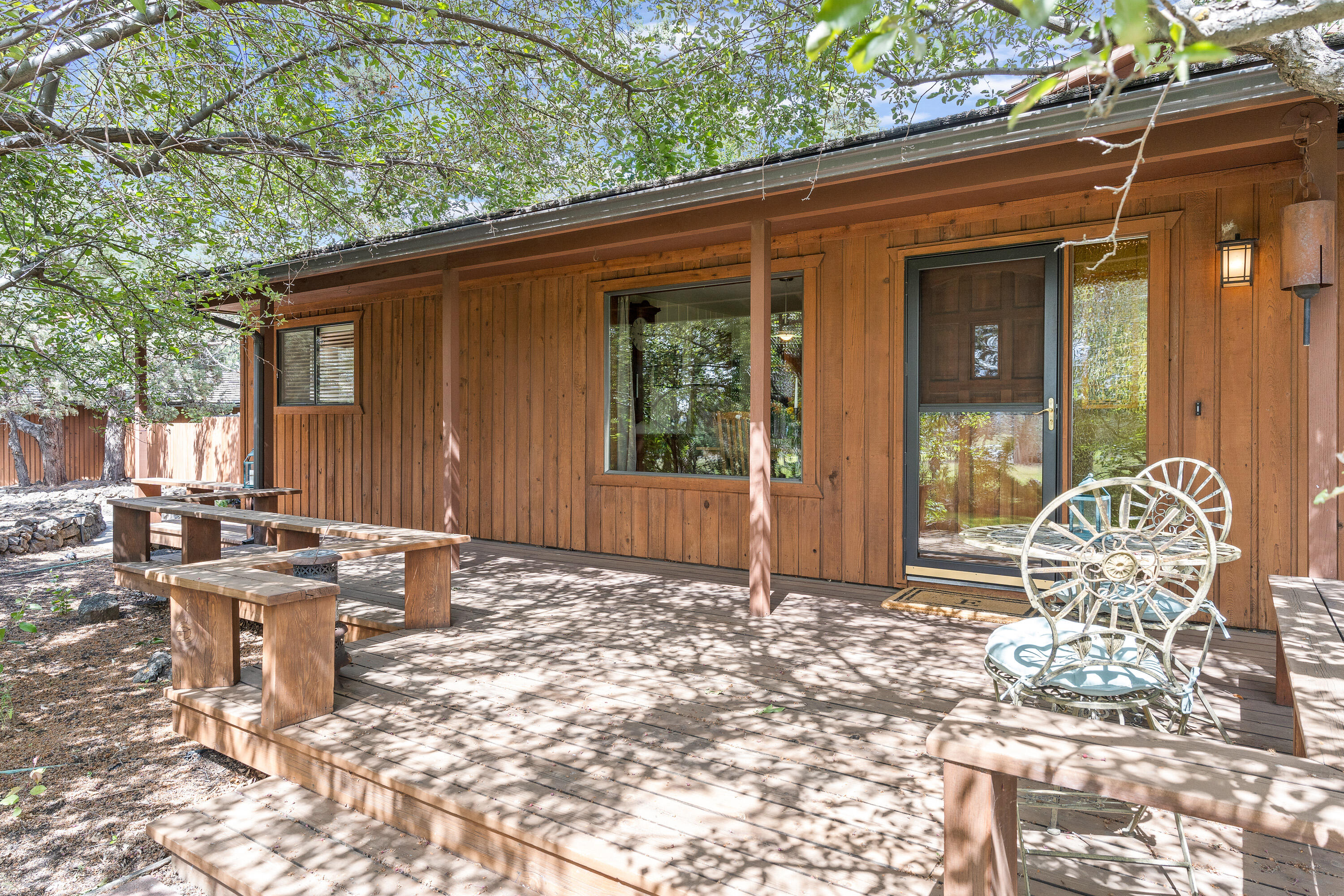 62636 Erickson Road Bend, OR 97701 - Photo 5 of 47 a patio with table and chairs and potted plants