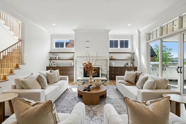 a living room with furniture and a chandelier