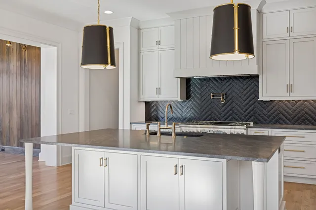 a kitchen with a sink and cabinets