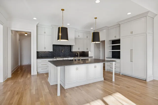 a spacious bedroom with a bed and a table