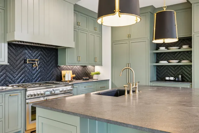 a dining room with furniture a chandelier and wooden floor