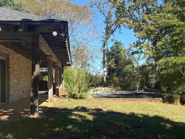 a view of swimming pool with yard